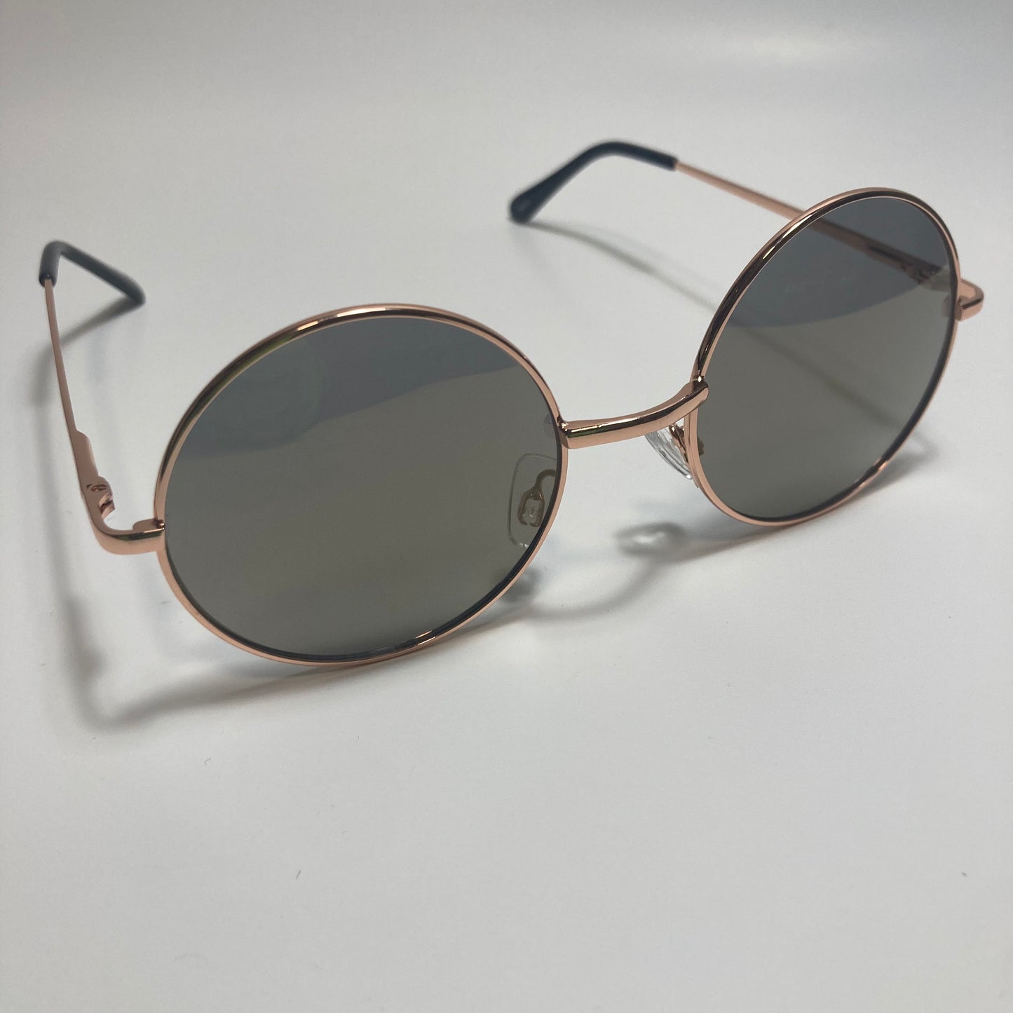 mens and womens gold and black round sunglasses