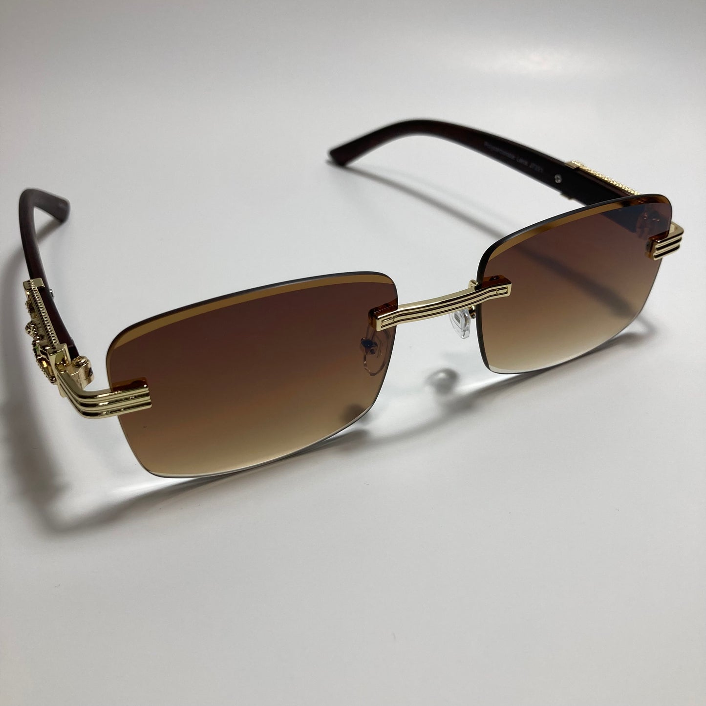 mens and womens gold and brown rimless square sunglasses