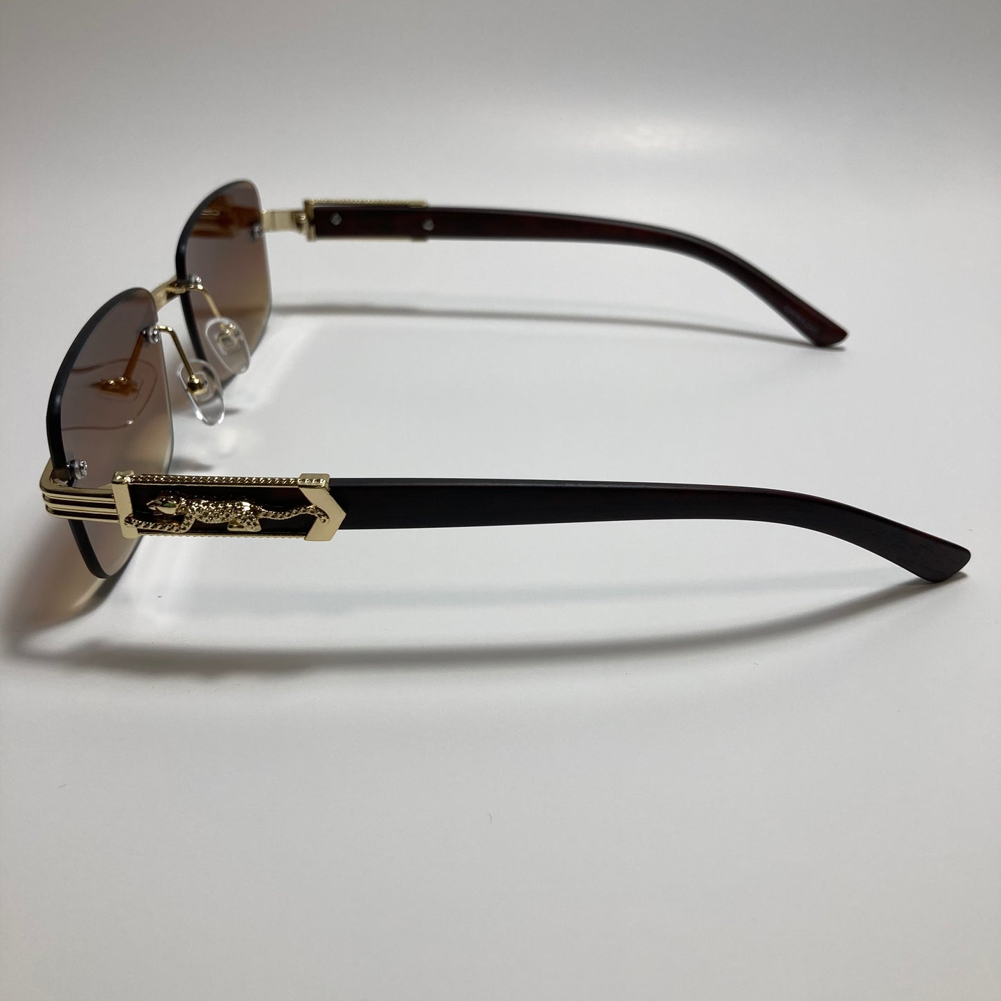 mens and womens gold and brown rimless square sunglasses