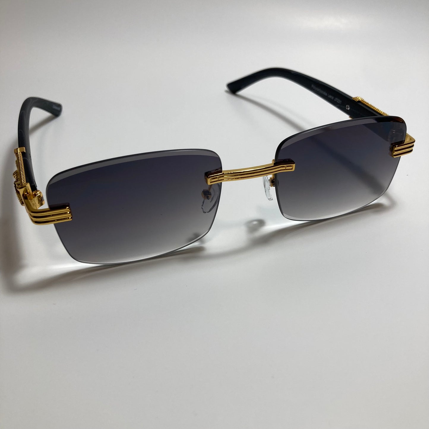 mens and womens gold and black rimless square sunglasses