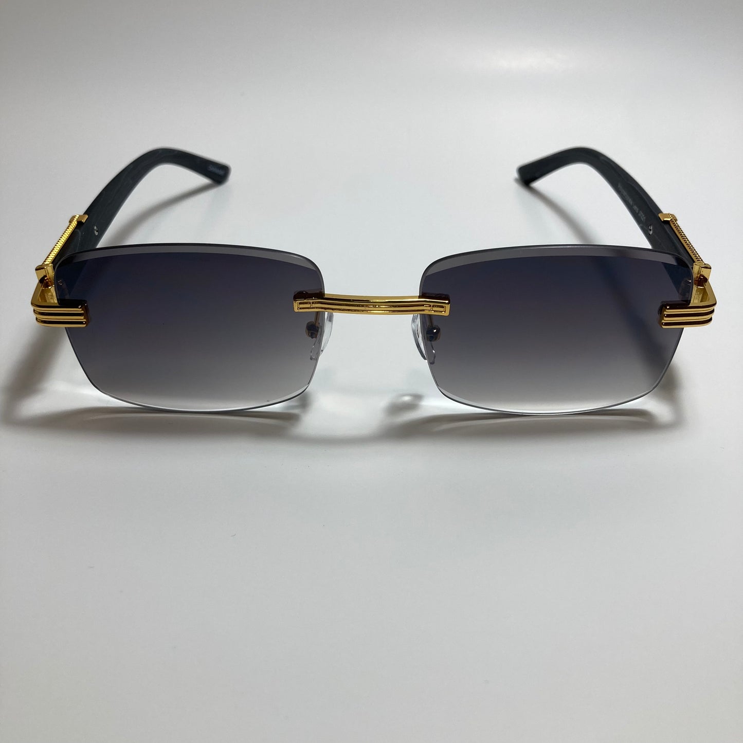 mens and womens gold and black rimless square sunglasses