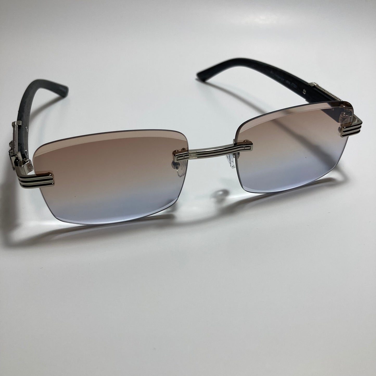 mens and womens silver and gray rimless square sunglasses