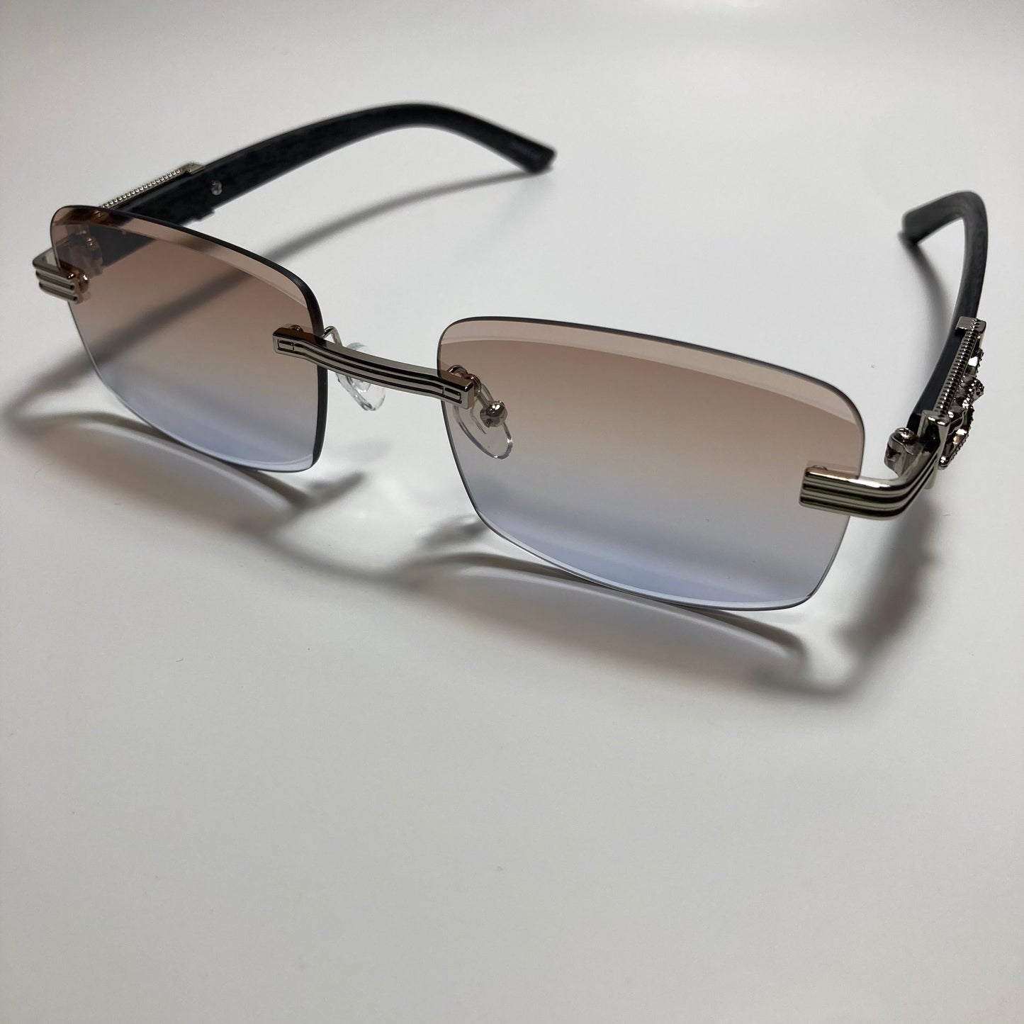 mens and womens silver and gray rimless square sunglasses