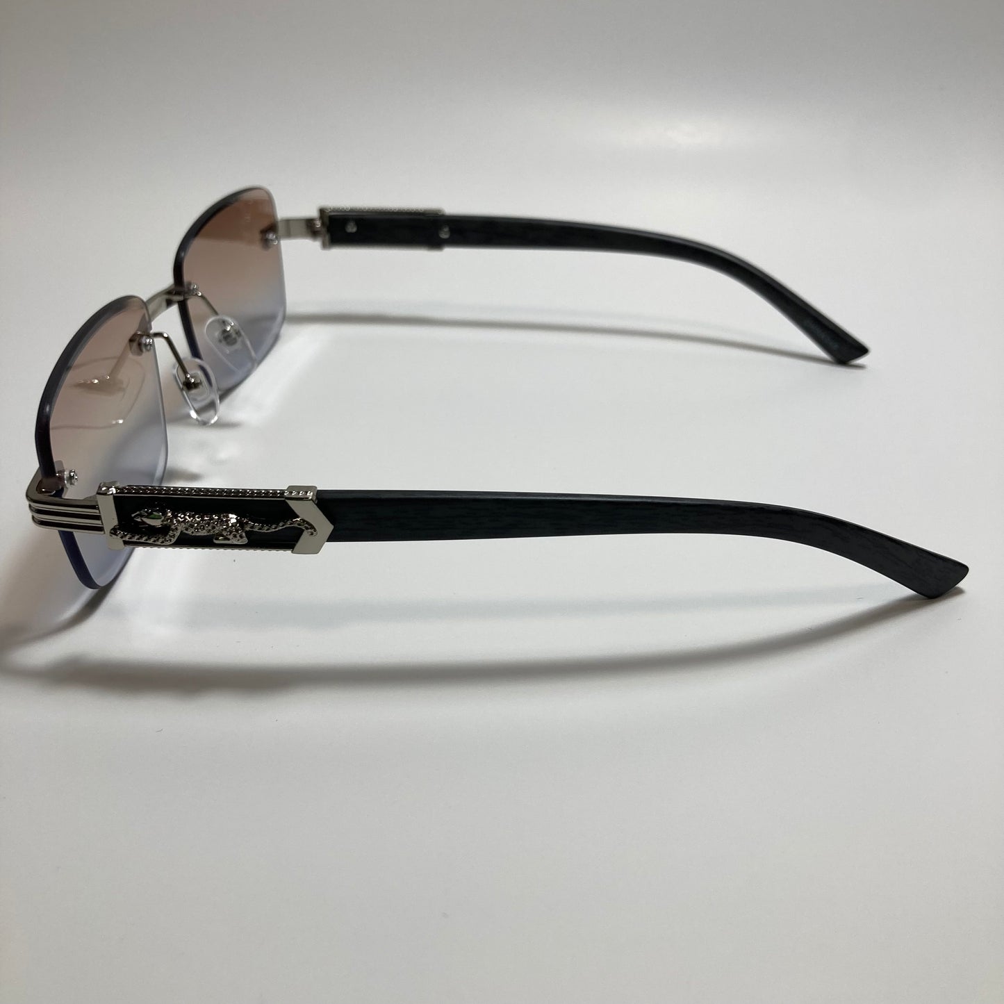 mens and womens silver and gray rimless square sunglasses