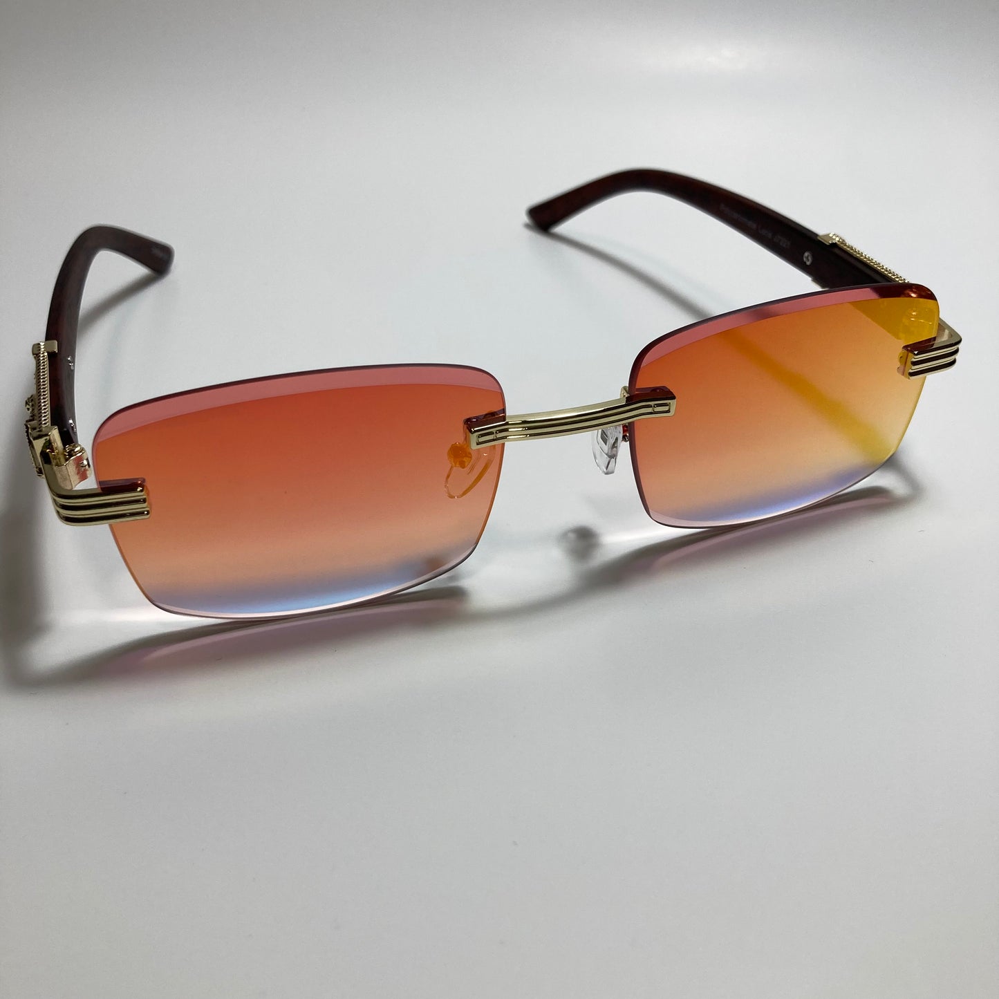 mens and womens gold and orange mirrored rimless square sunglasses