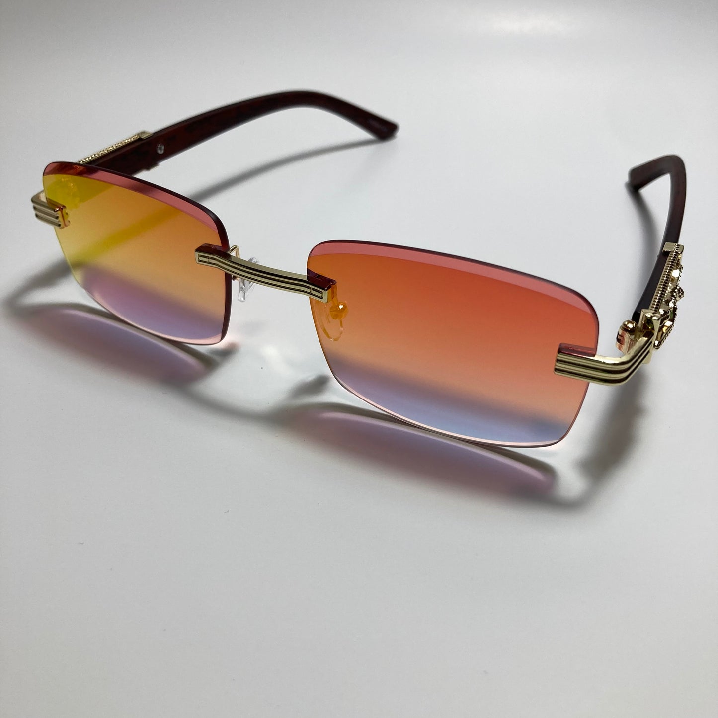 mens and womens gold and orange mirrored rimless square sunglasses