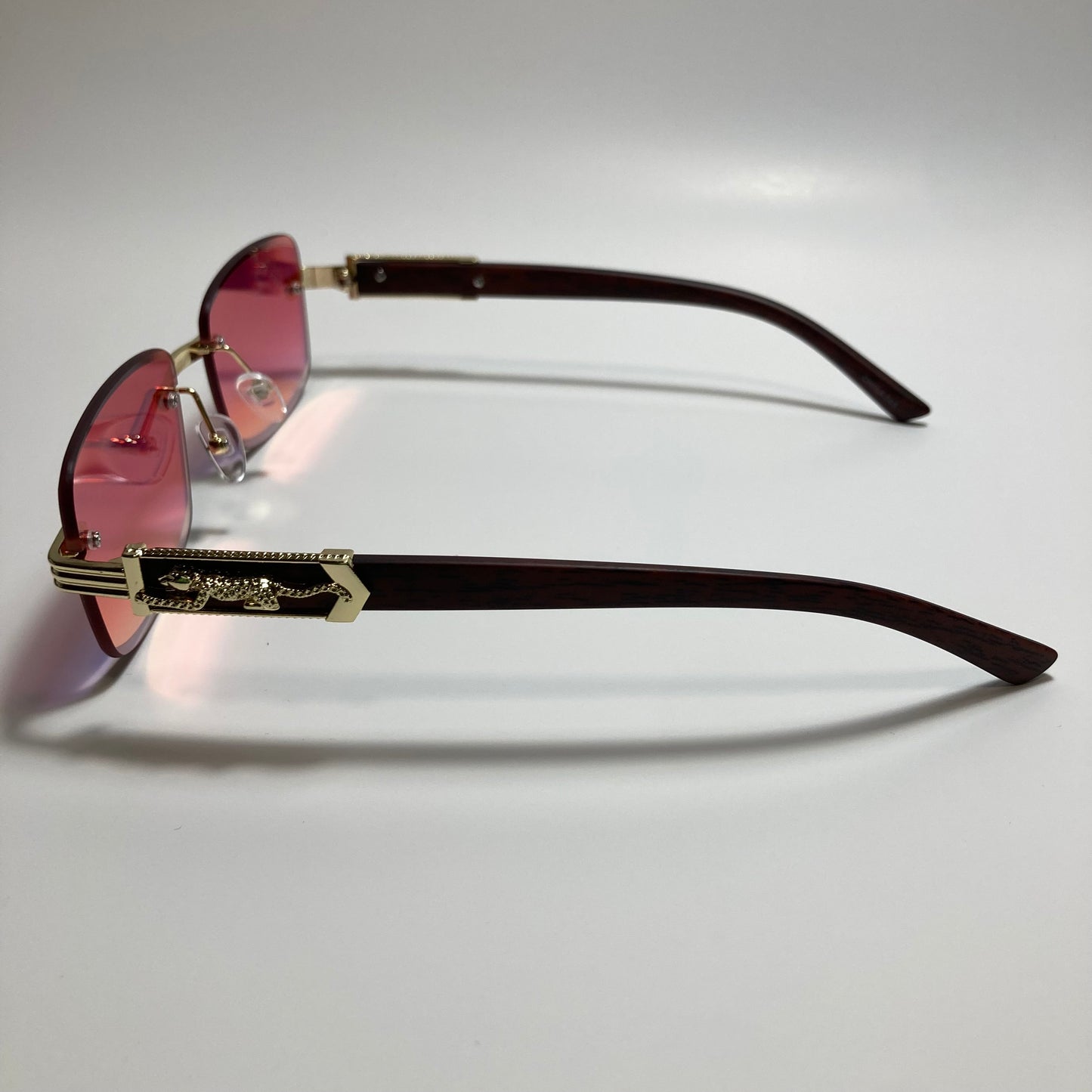 mens and womens gold and orange mirrored rimless square sunglasses
