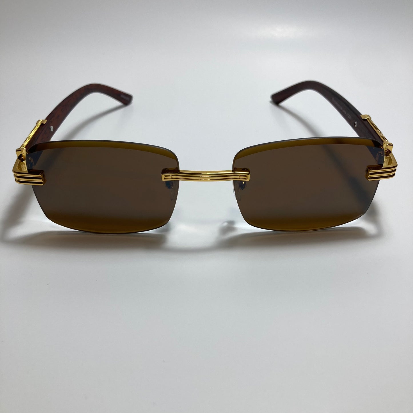 mens and womens gold and brown rimless square sunglasses