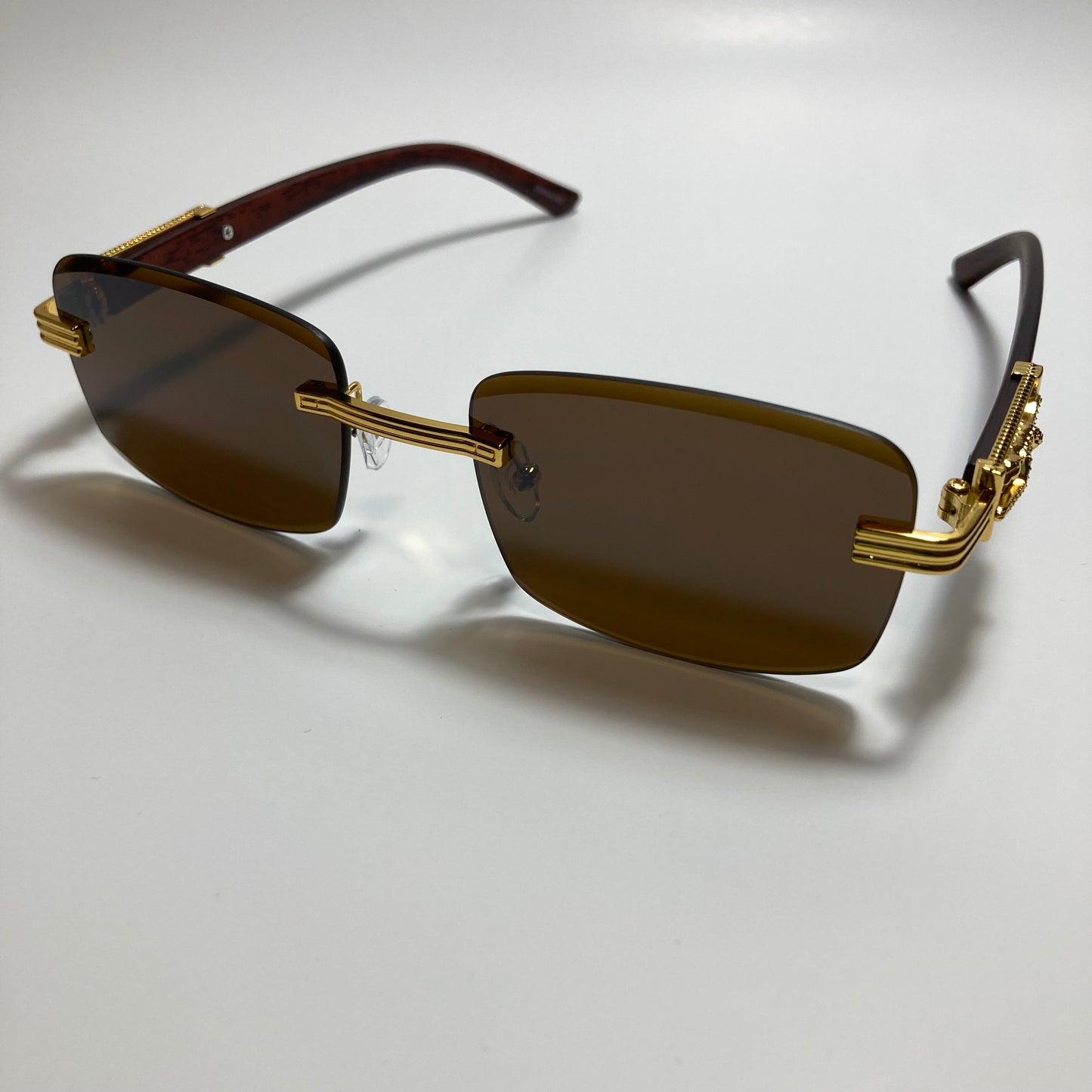 mens and womens gold and brown rimless square sunglasses