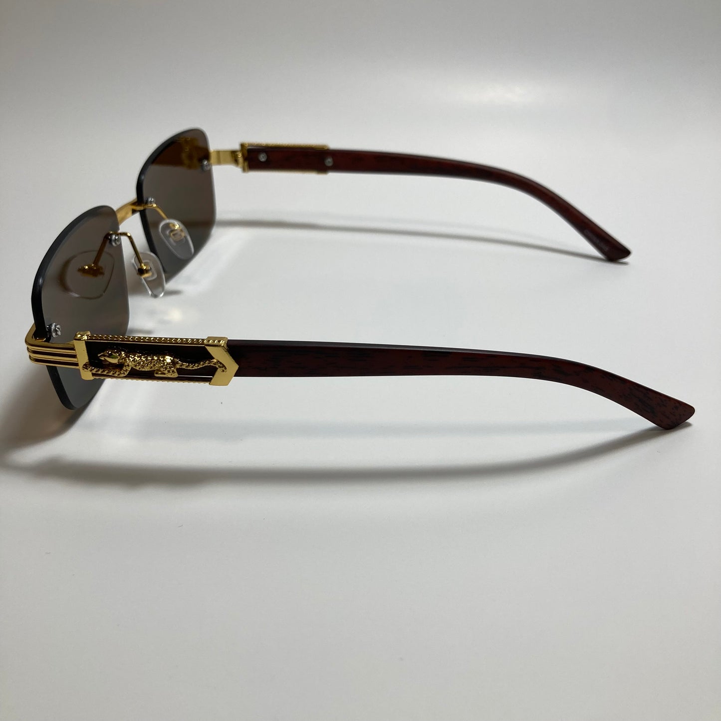 mens and womens gold and brown rimless square sunglasses