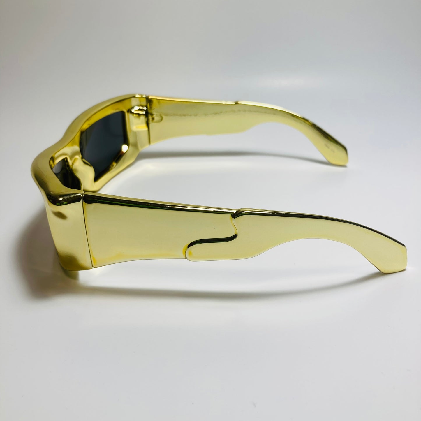 mens and womens futuristic sunglasses gold and black