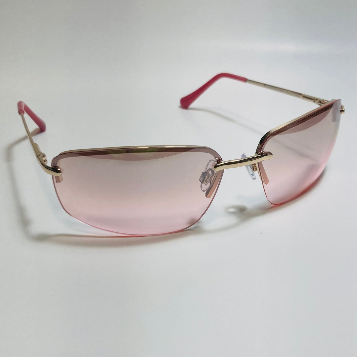 mens and womens gold and pink half rim wrap 2000s sunglasses