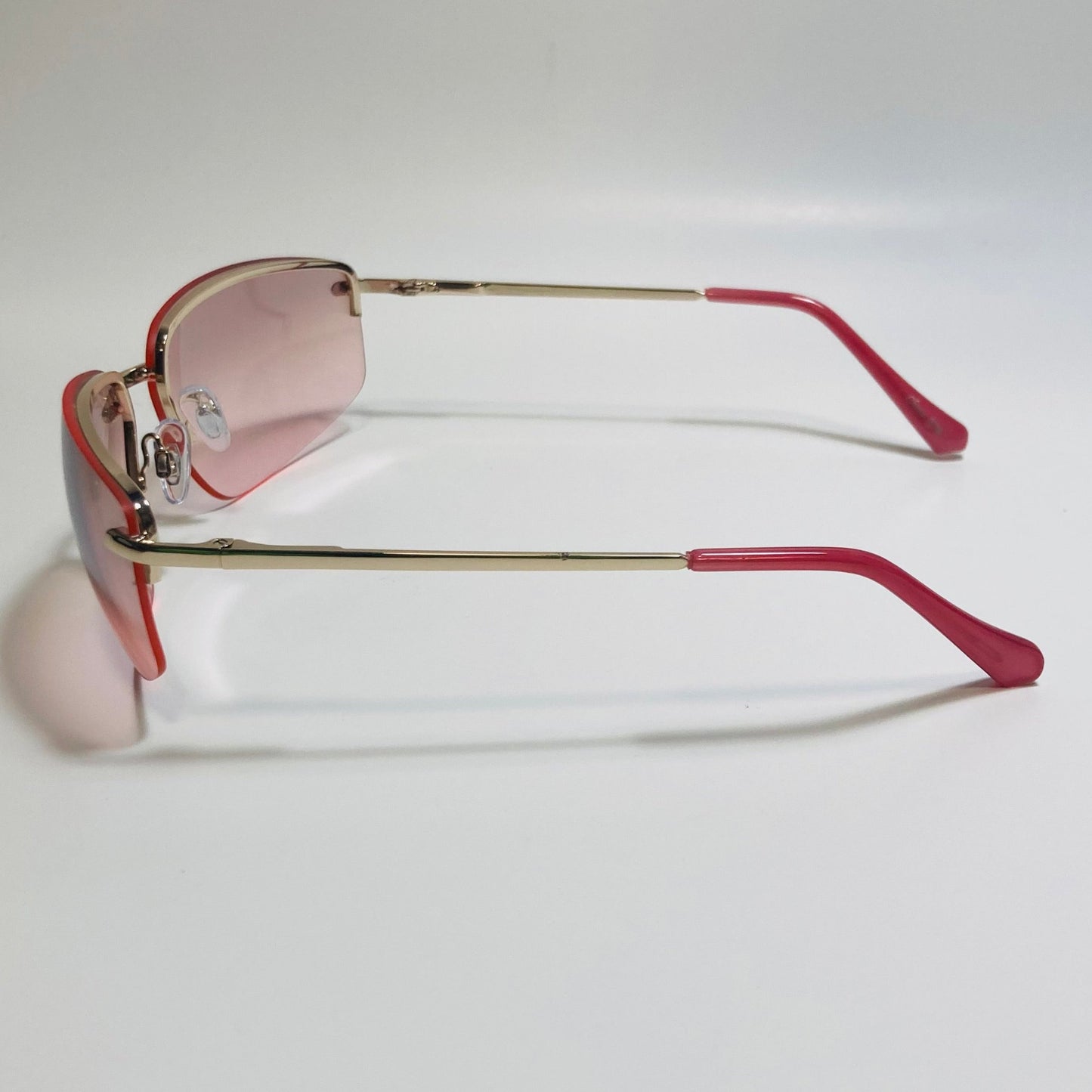 mens and womens gold and pink half rim wrap 2000s sunglasses