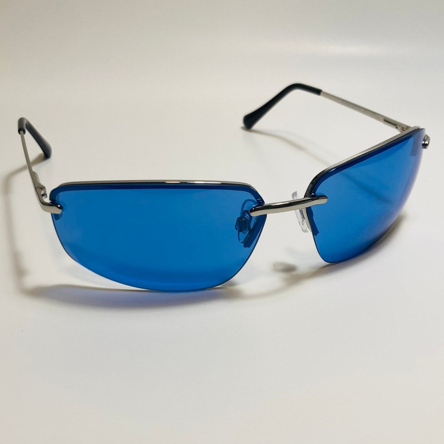 mens and womens silver and blue half rim wrap 2000s sunglasses