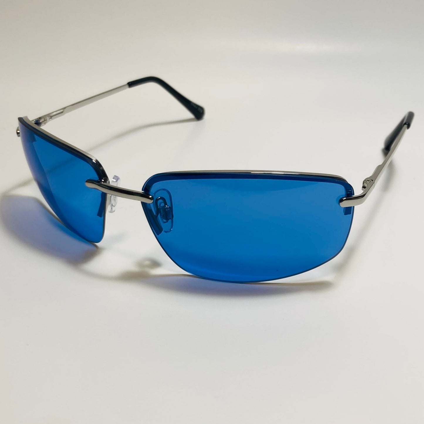 mens and womens silver and blue half rim wrap 2000s sunglasses