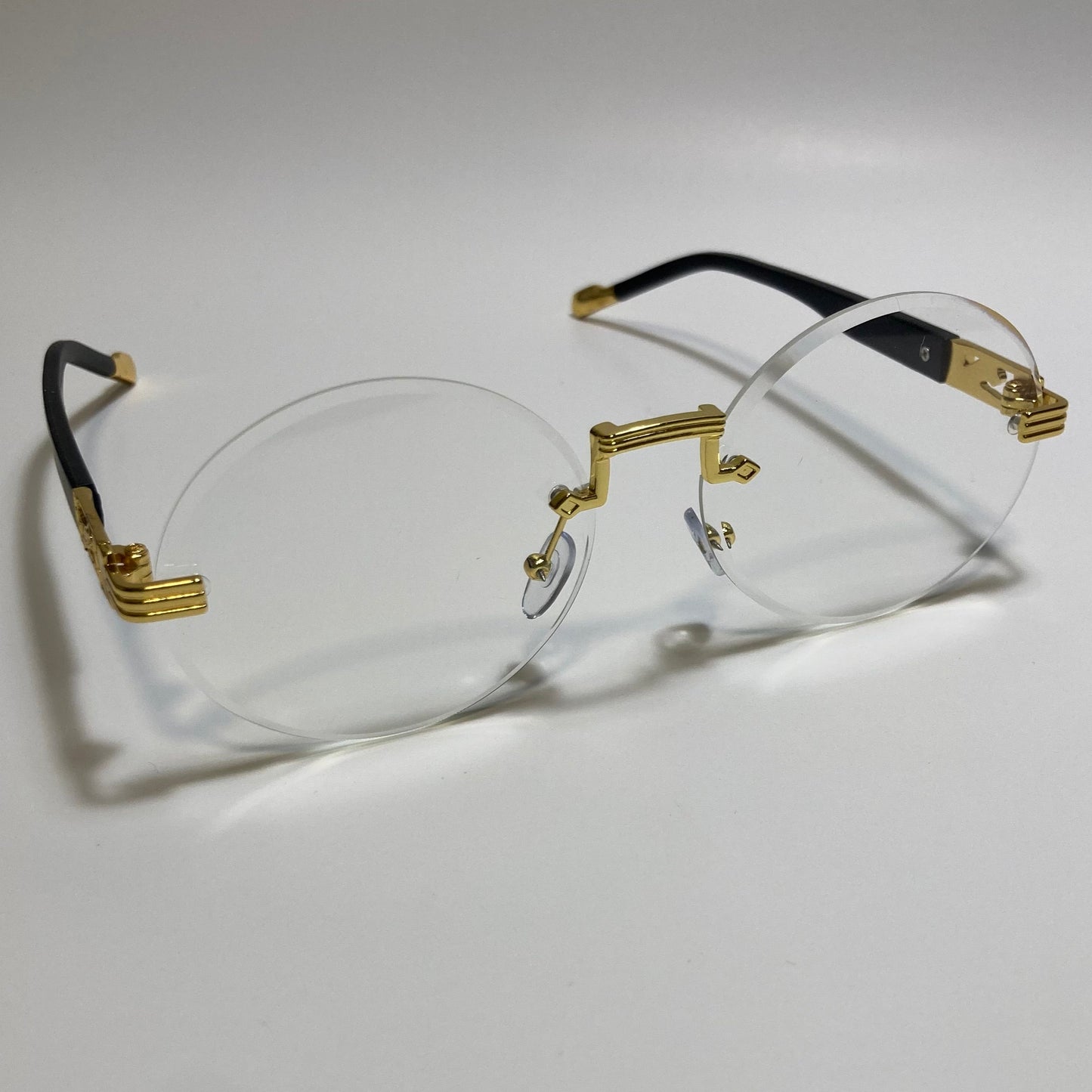 mens and womens rimless round glasses with clear lenses and gold frame