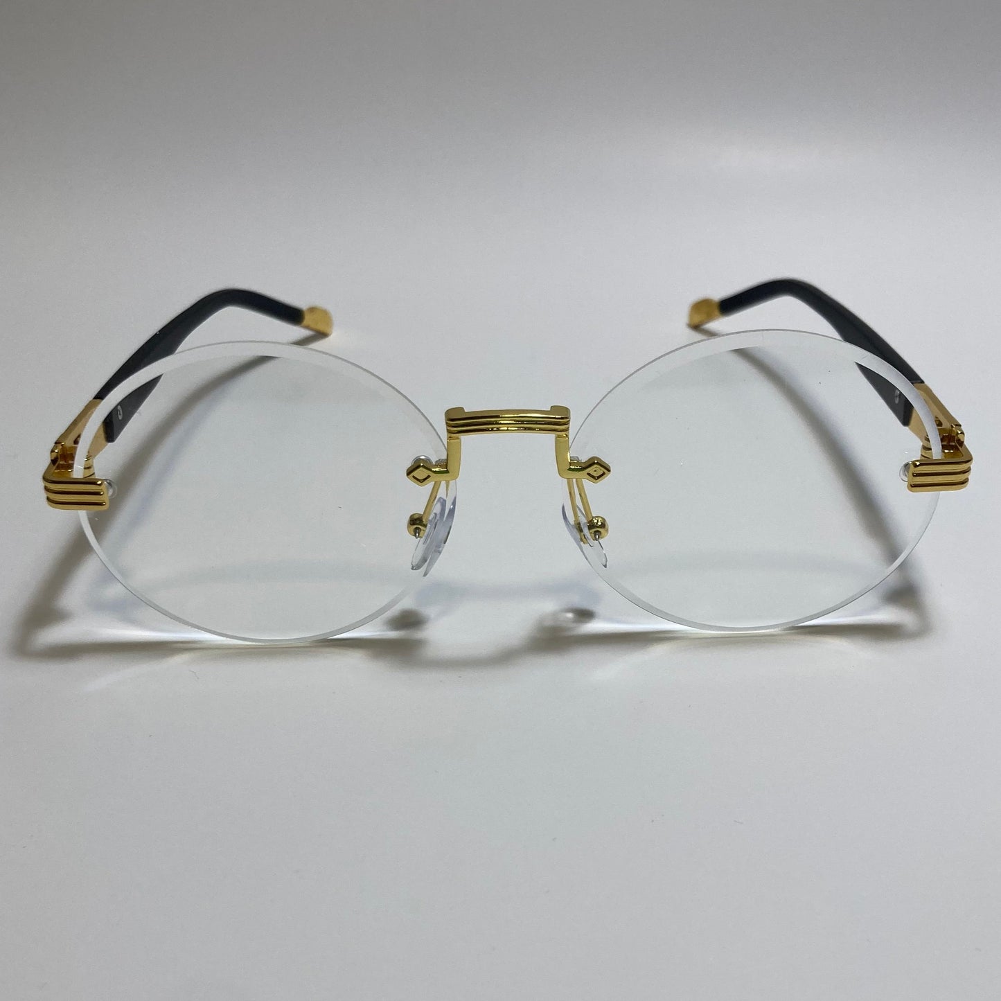 mens and womens rimless round glasses with clear lenses and gold frame