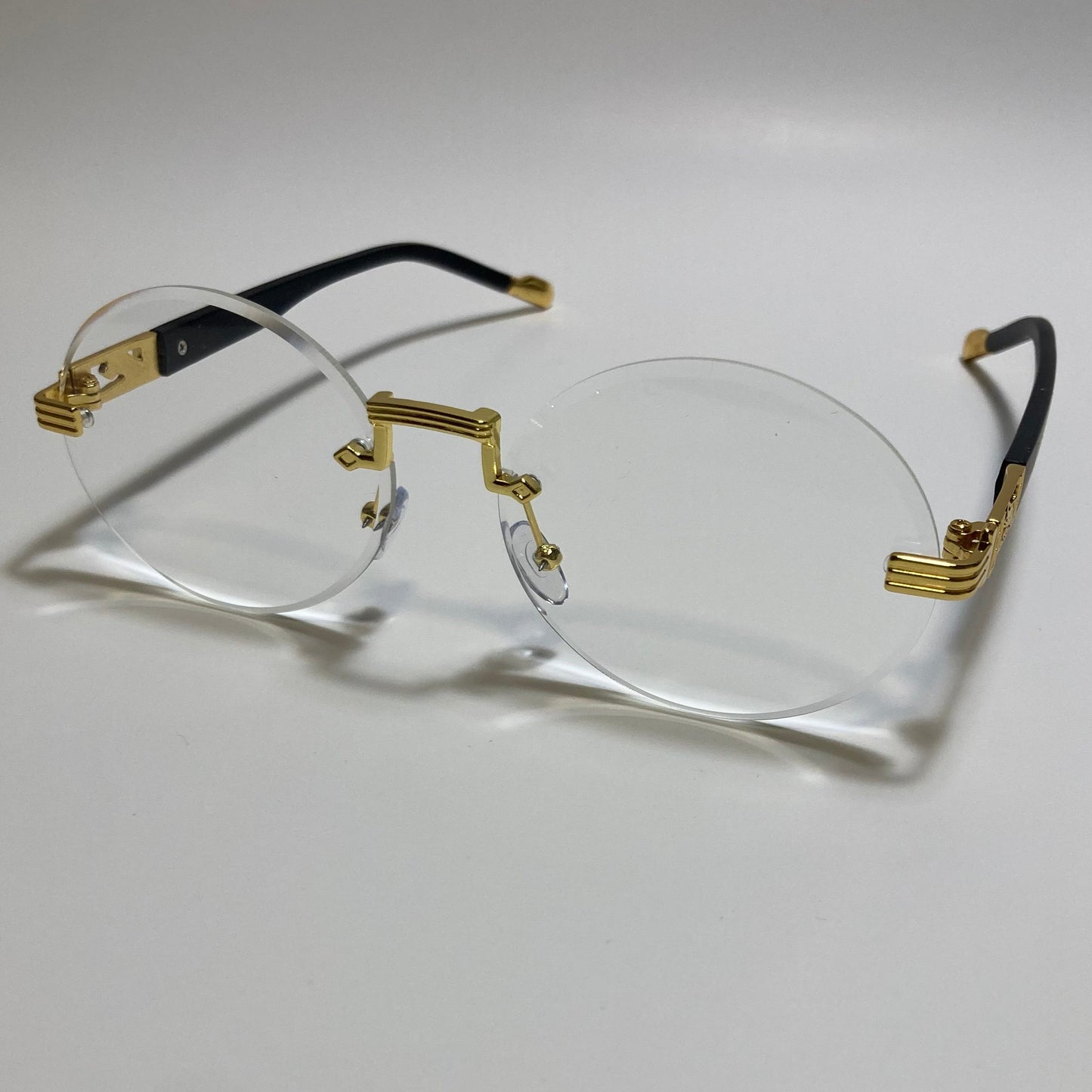 mens and womens rimless round glasses with clear lenses and gold frame