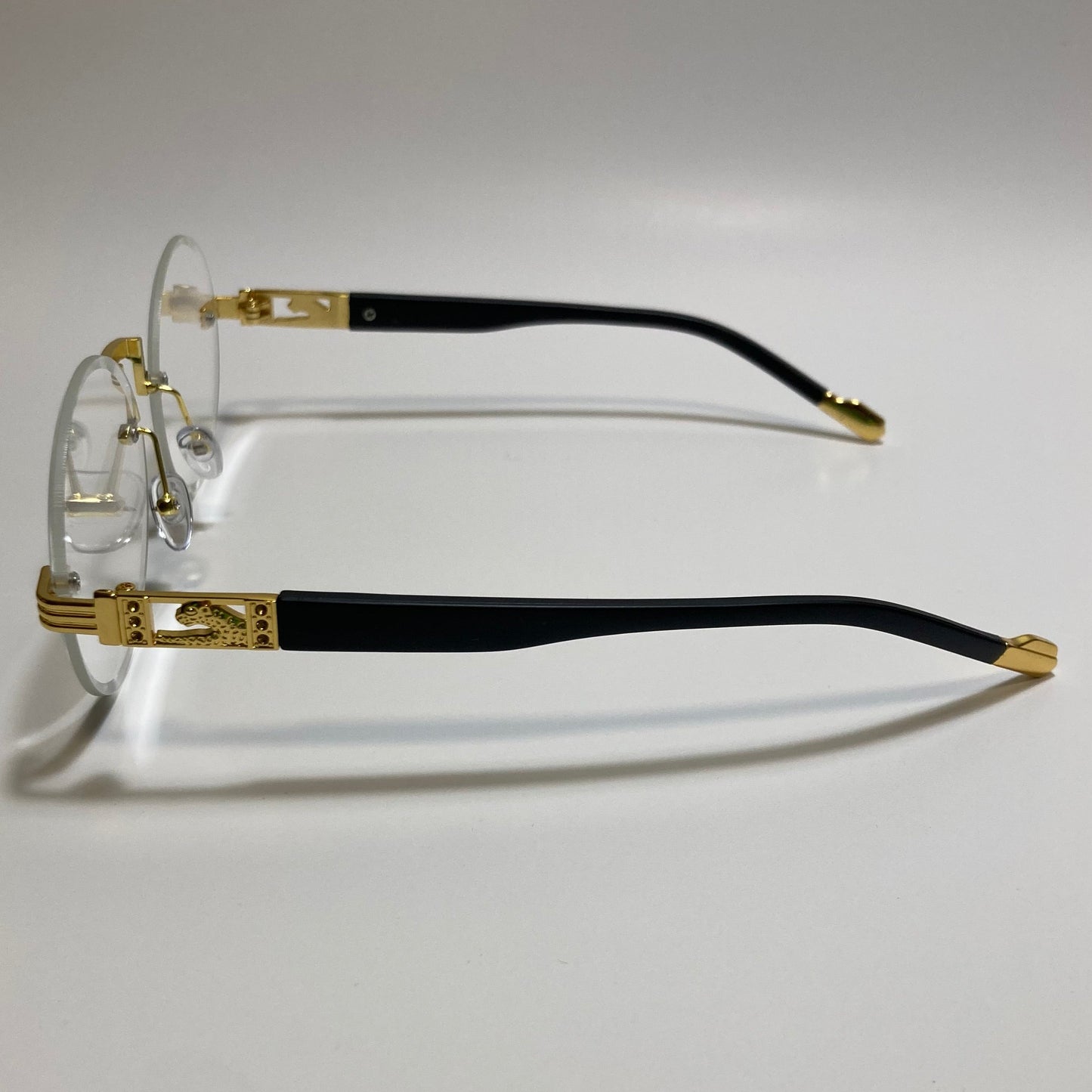 mens and womens rimless round glasses with clear lenses and gold frame