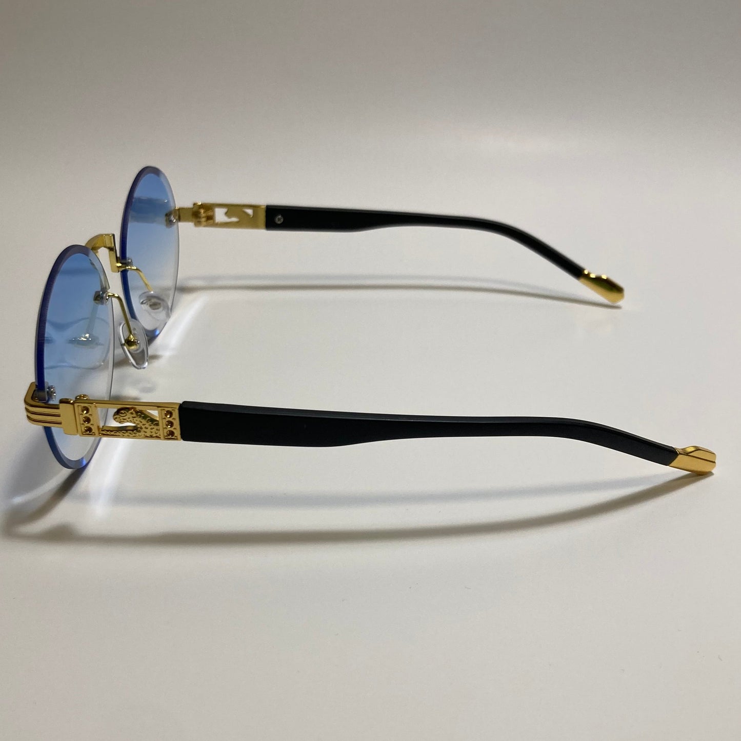 mens and womens rimless round sunglasses with blue lenses and gold frame