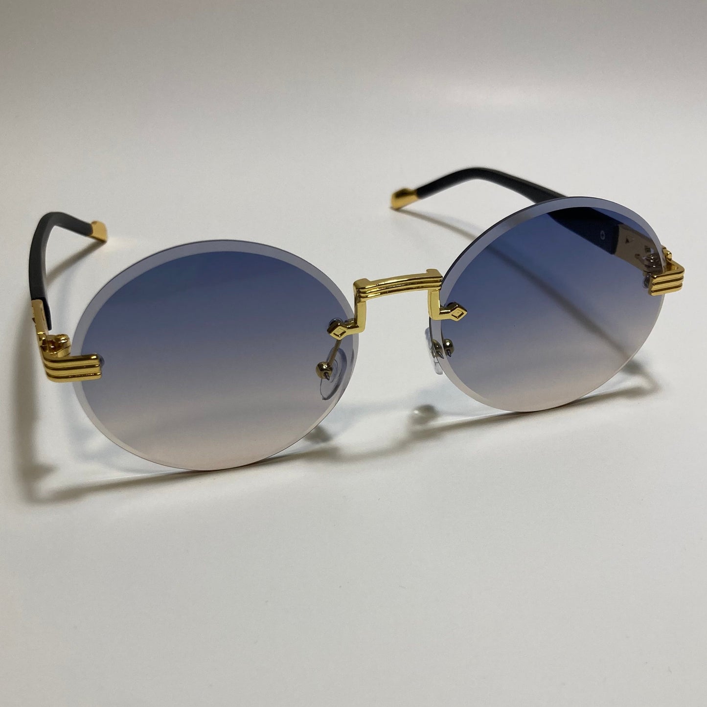 mens and womens rimless round glasses with purple and yellow lenses and gold frame