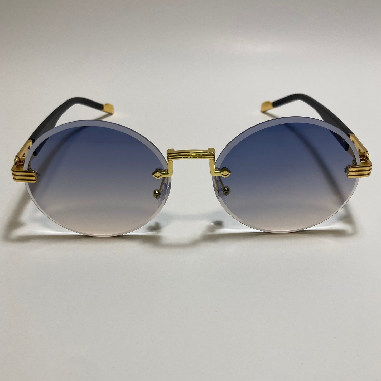 mens and womens rimless round glasses with purple and yellow lenses and gold frame