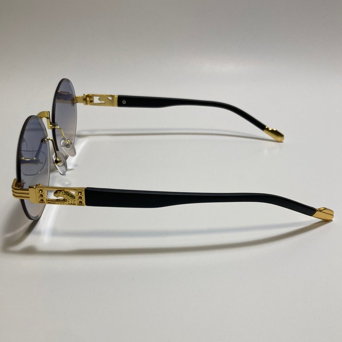 mens and womens rimless round glasses with purple and yellow lenses and gold frame