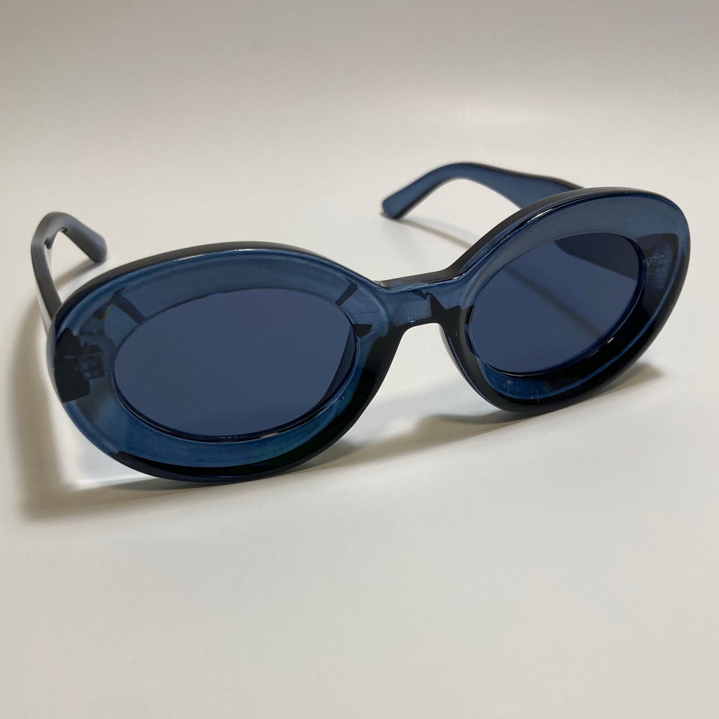 clear blue round womens MCM sunglasses with chunky frame