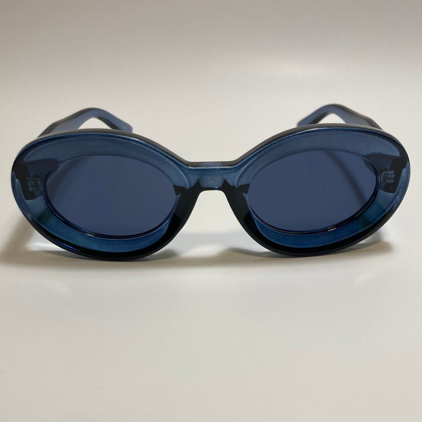 clear blue round womens MCM sunglasses with chunky frame