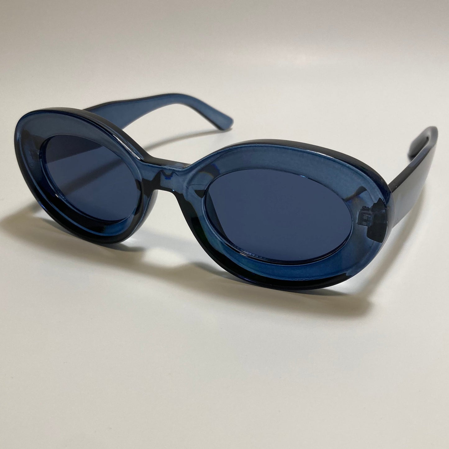 clear blue round womens MCM sunglasses with chunky frame