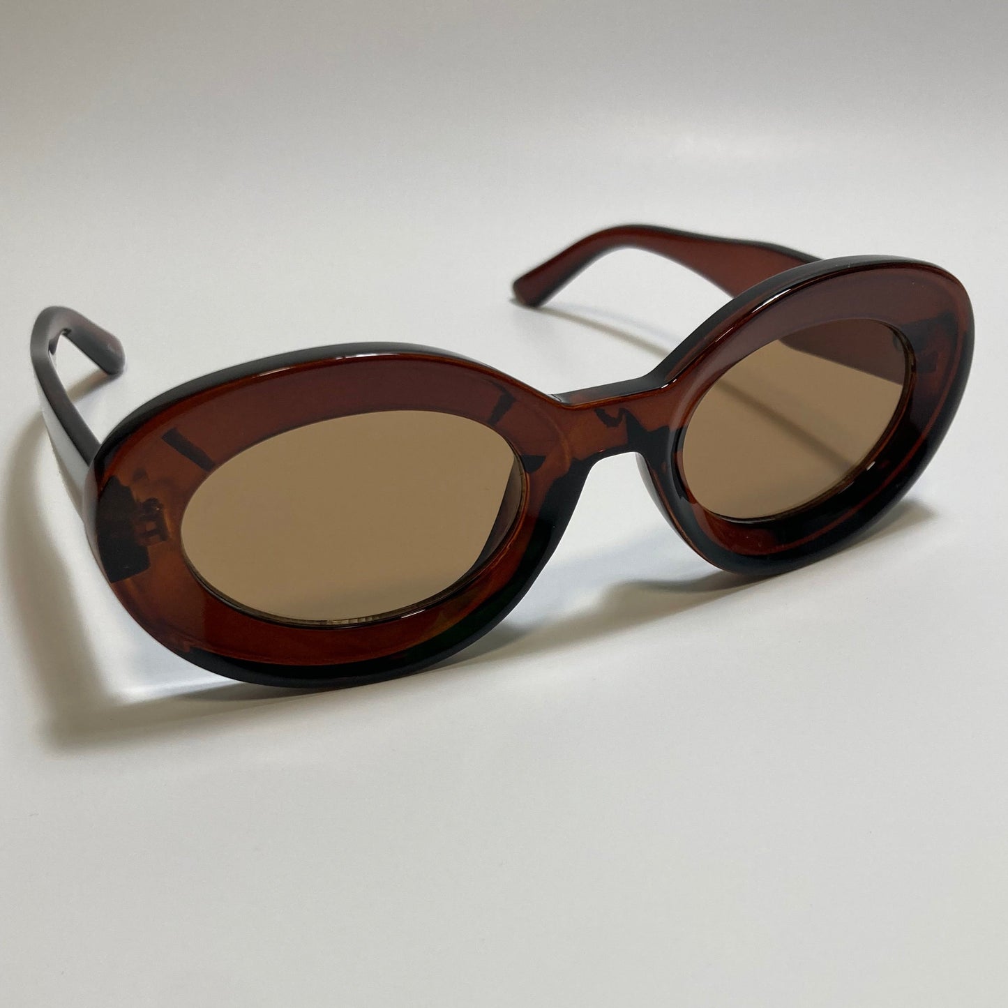clear brown round womens MCM sunglasses with chunky frame