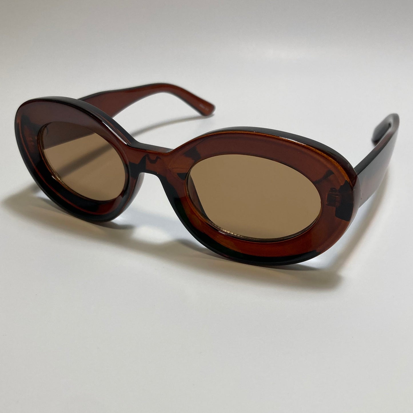 clear brown round womens MCM sunglasses with chunky frame