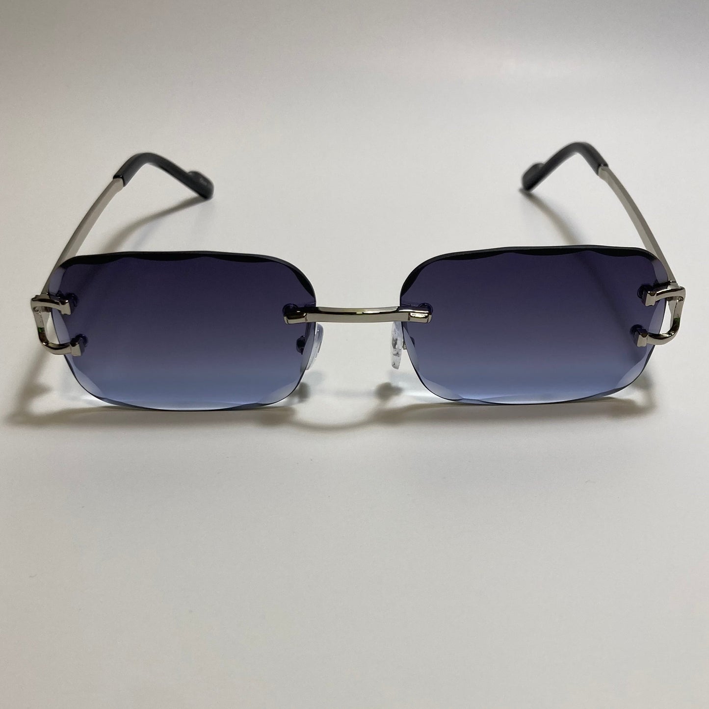 unisex blue and silver rimless oval sunglasses