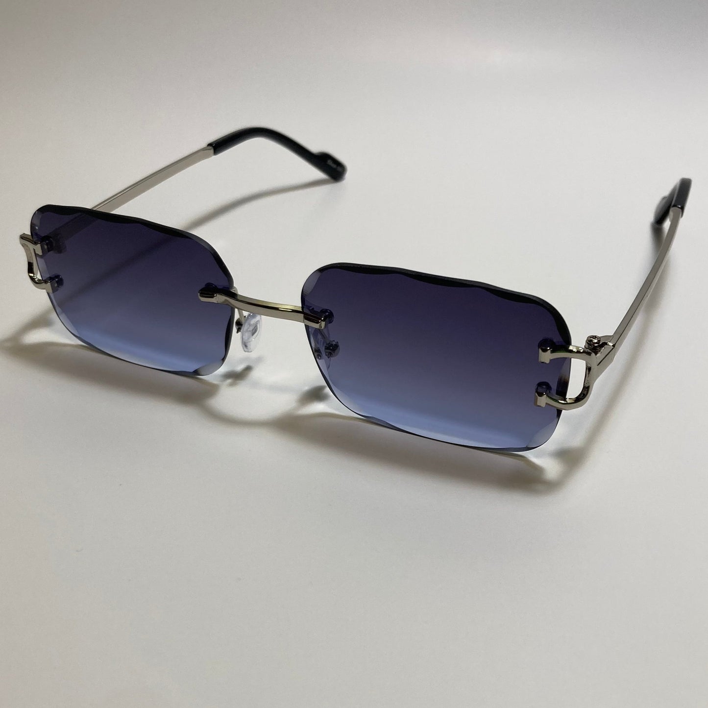unisex blue and silver rimless oval sunglasses