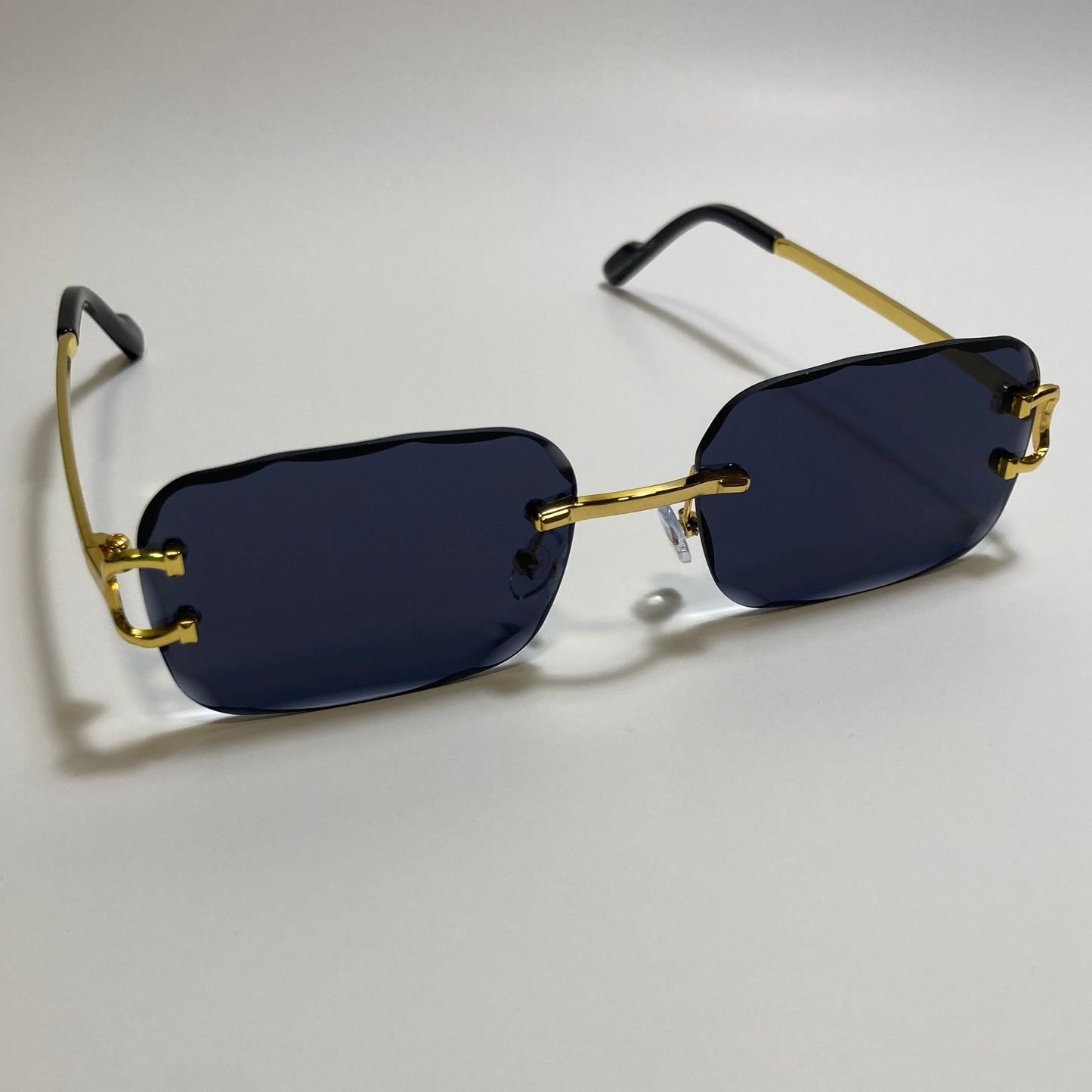 unisex black and gold rimless oval sunglasses