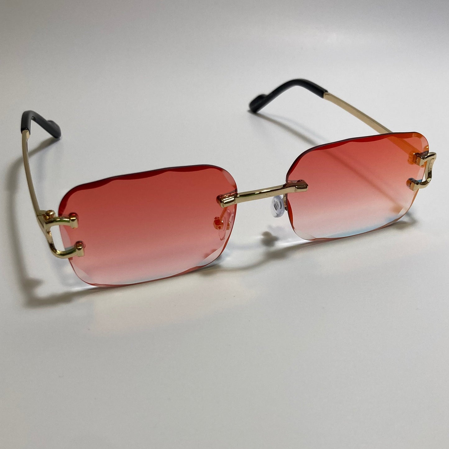 unisex mirrored orange and gold rimless oval sunglasses