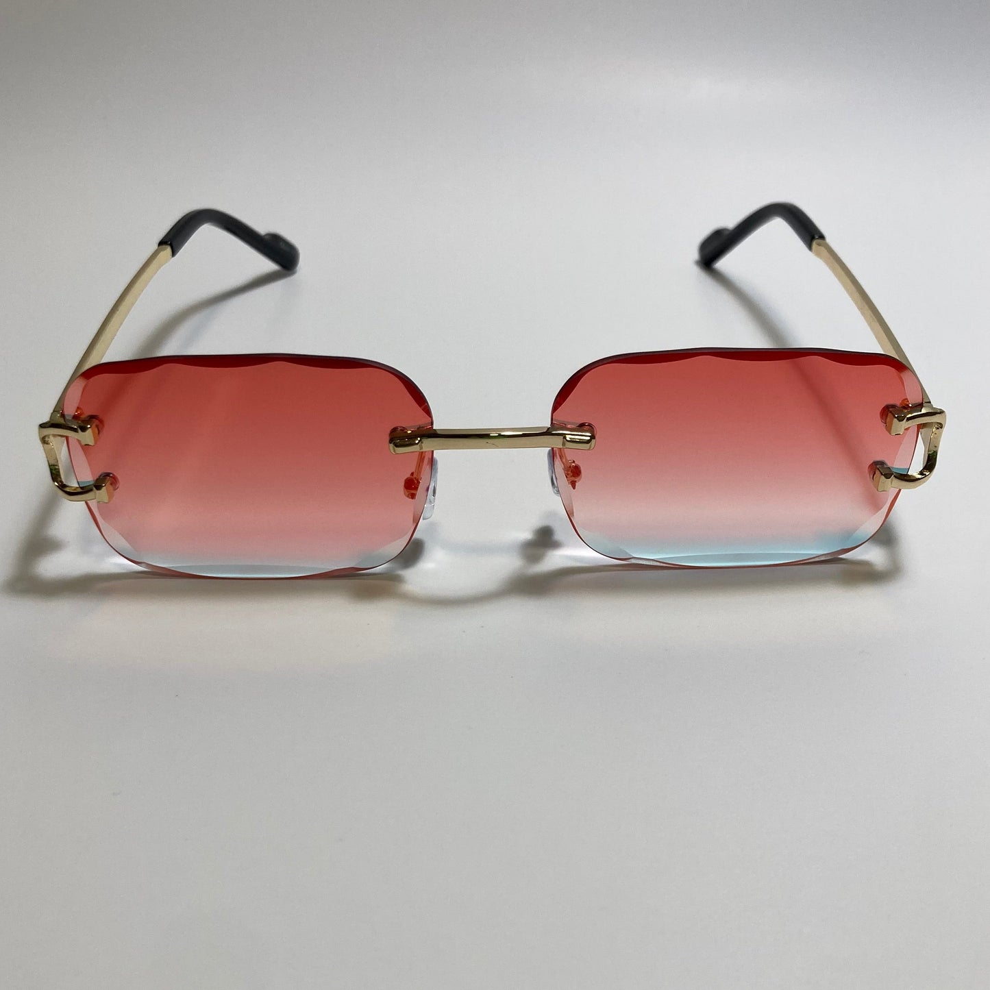 unisex mirrored orange and gold rimless oval sunglasses
