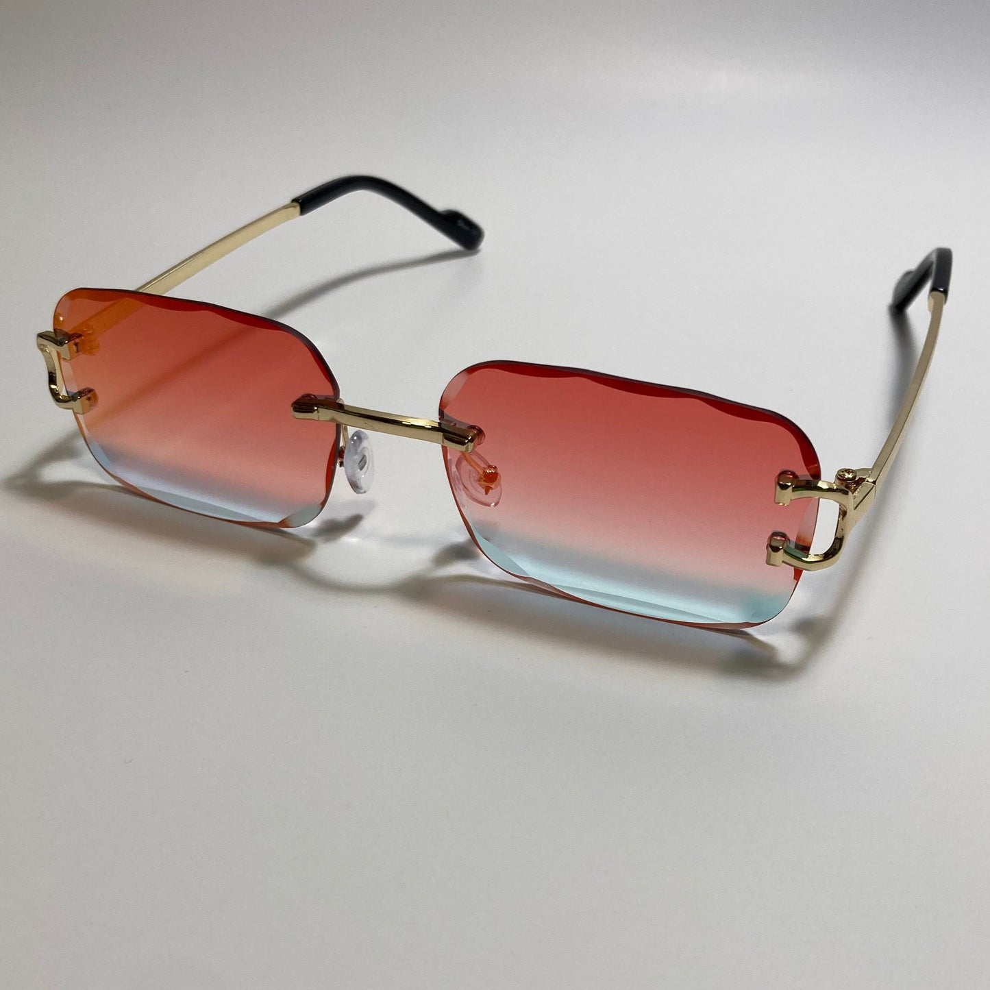 unisex mirrored orange and gold rimless oval sunglasses