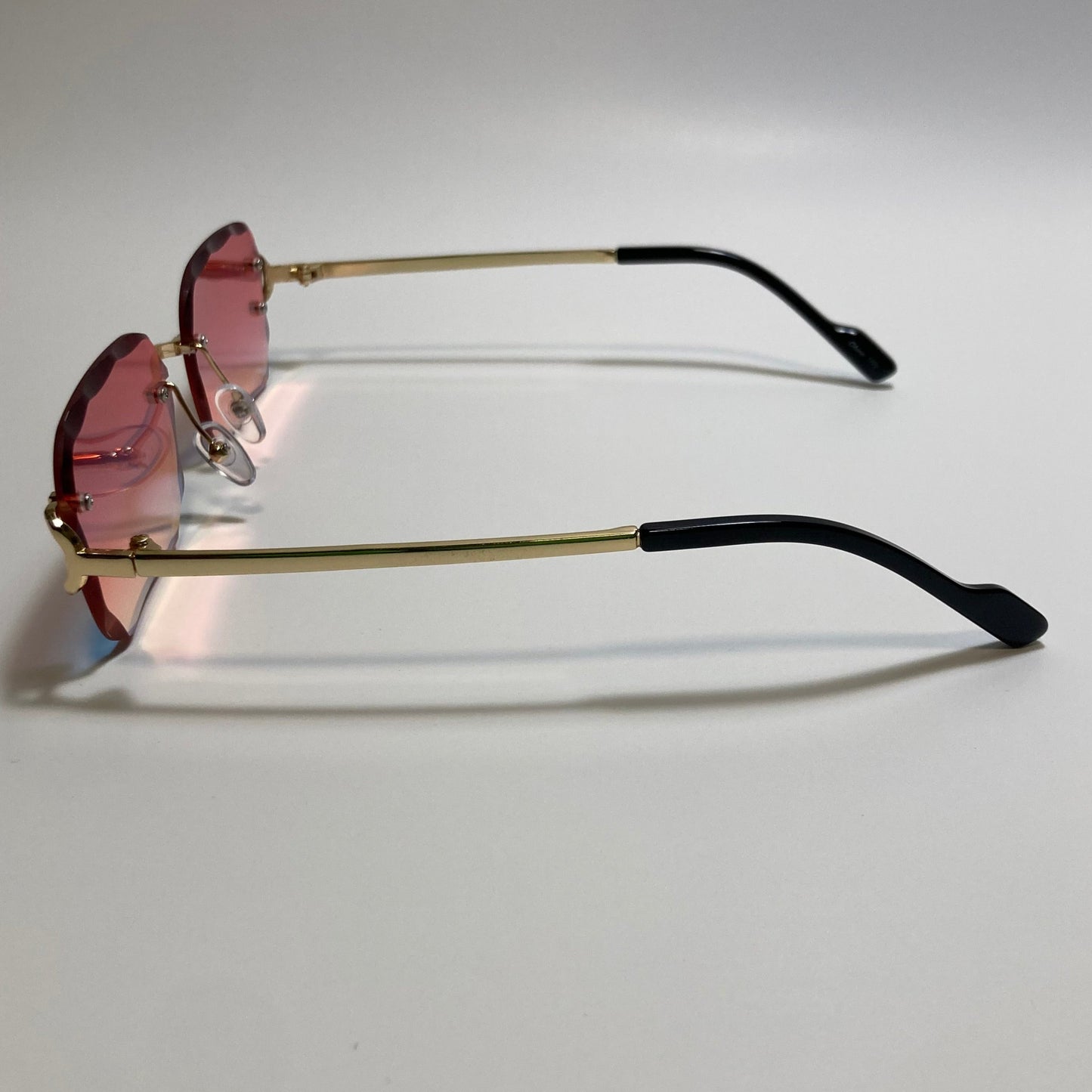 unisex mirrored orange and gold rimless oval sunglasses