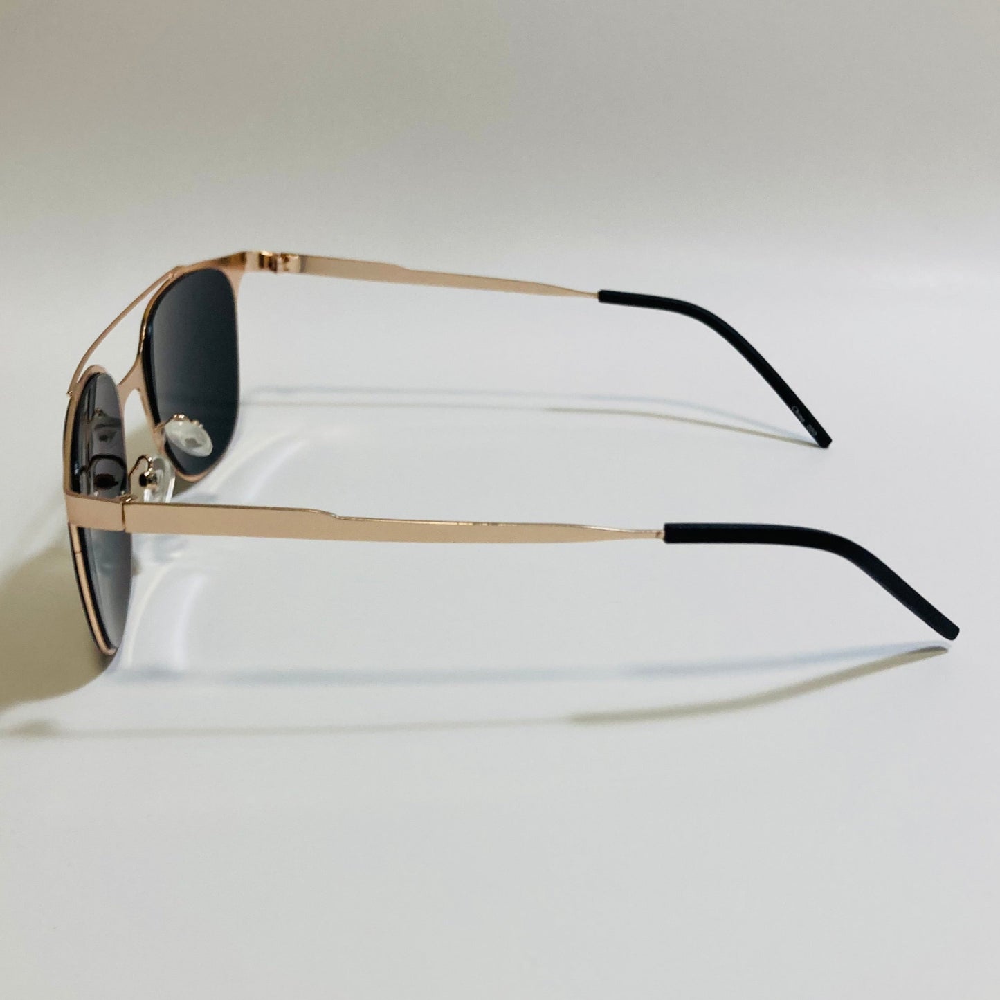 Square gold crossbar sunglasses with mirrored purple lenses