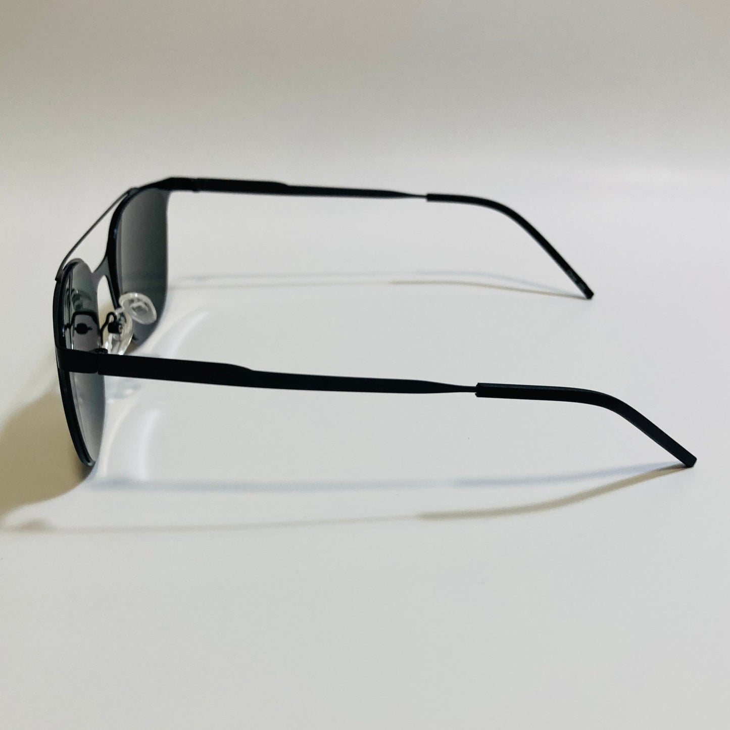 Square black crossbar sunglasses with mirrored yellow lenses