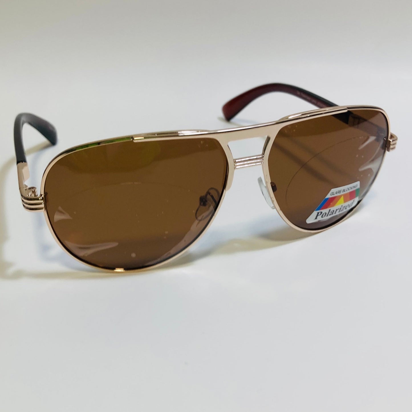 Polarized gold and brown aviator sunglasses with engraved metal frame