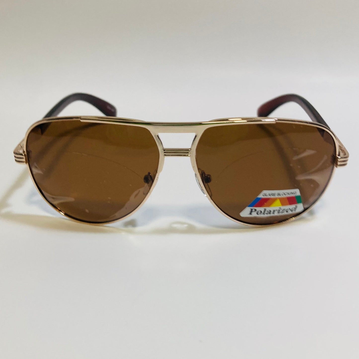 Polarized gold and brown aviator sunglasses with engraved metal frame