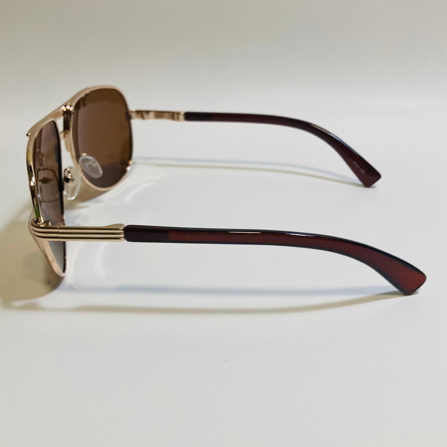 Polarized gold and brown aviator sunglasses with engraved metal frame
