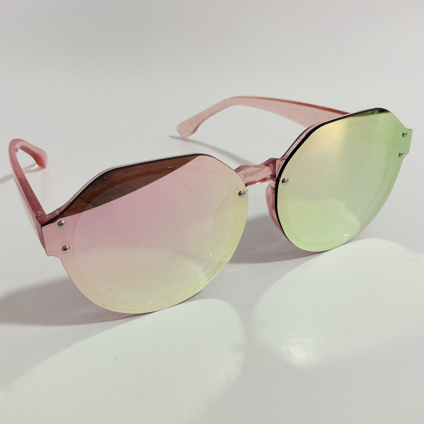 womens green and pink mirrored round glitter sunglasses