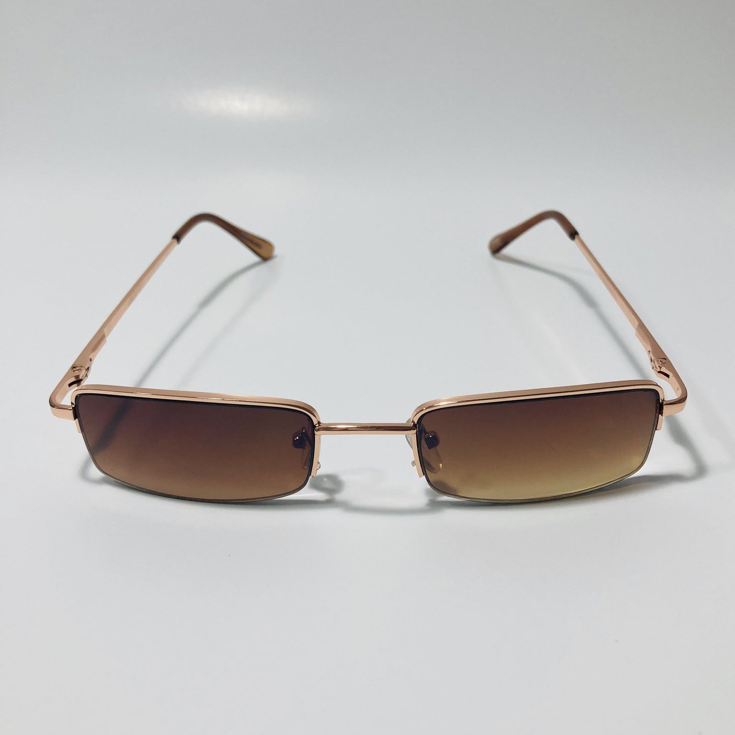 womens and mens brown and gold metal square sunglasses