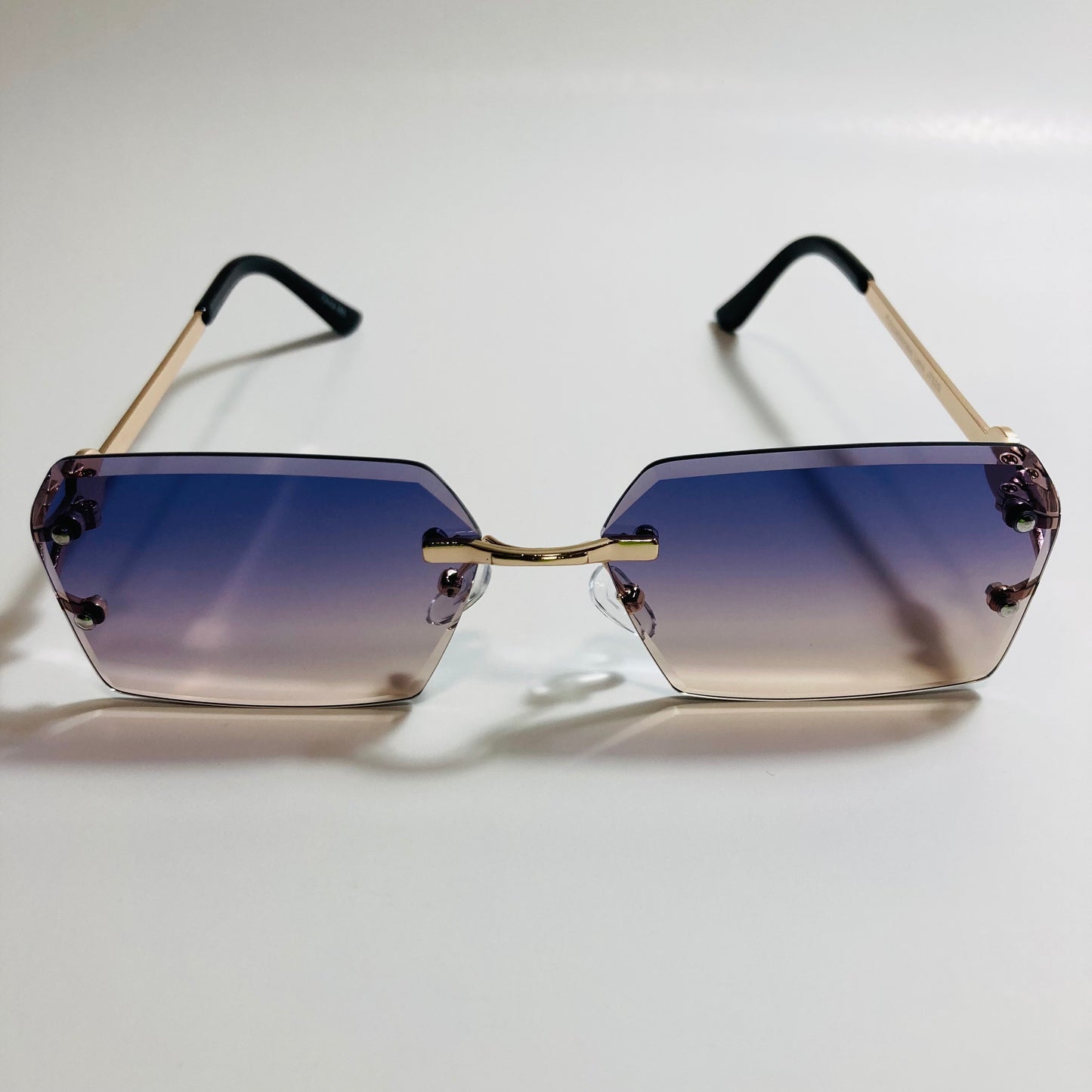 mens and womens purple yellow and gold rimless square sunglsses