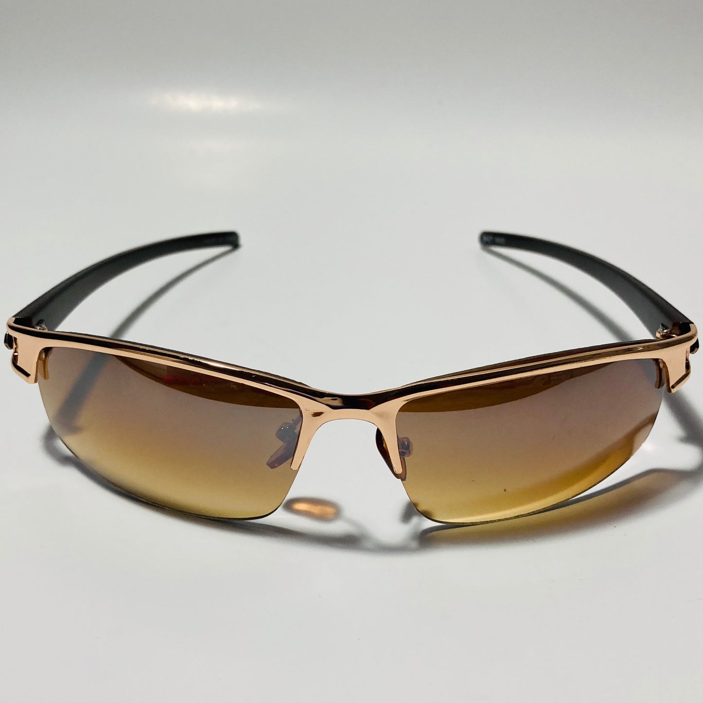 womens and mens gold wrap around sunglasses with brown lenses