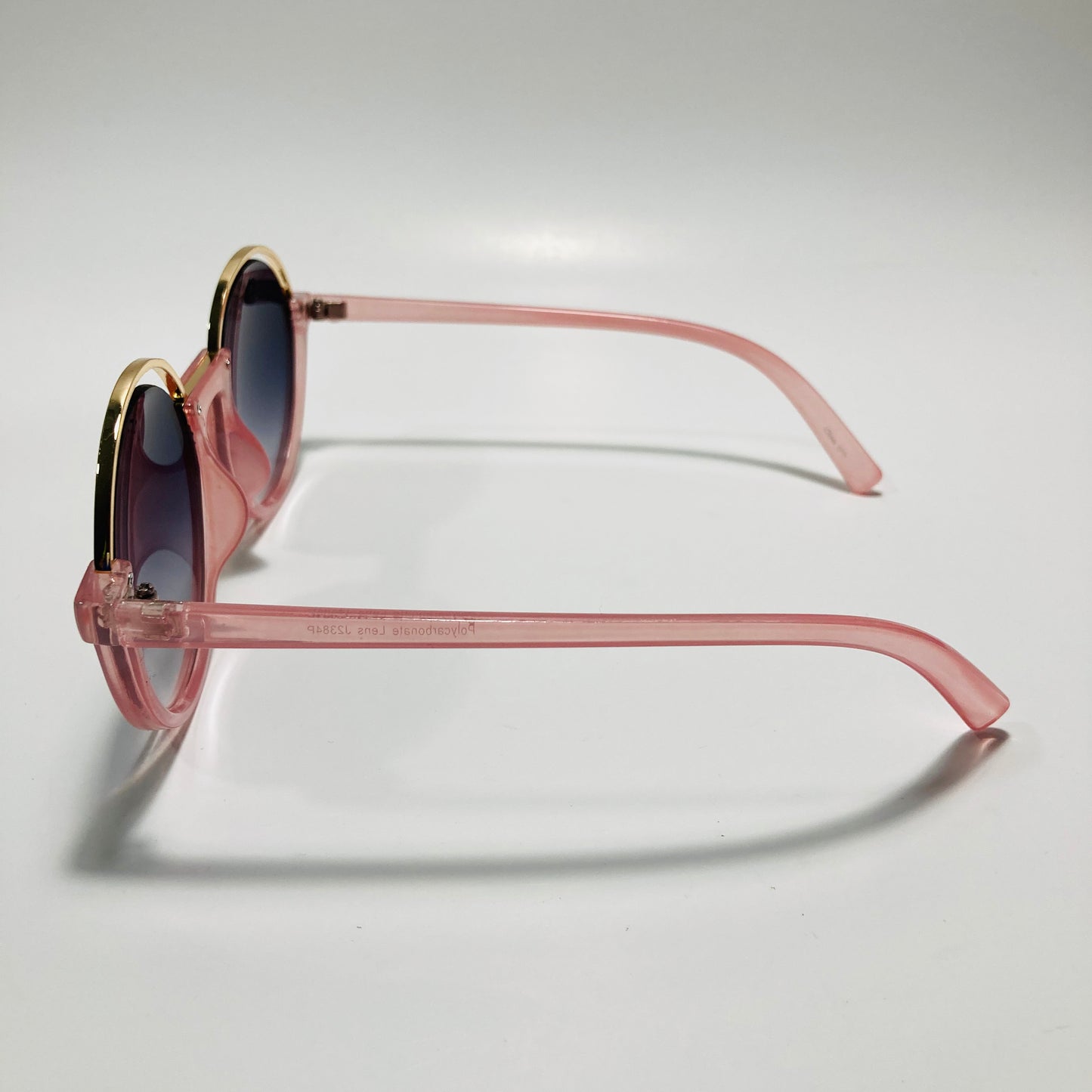 womens pink and black round sunglasses