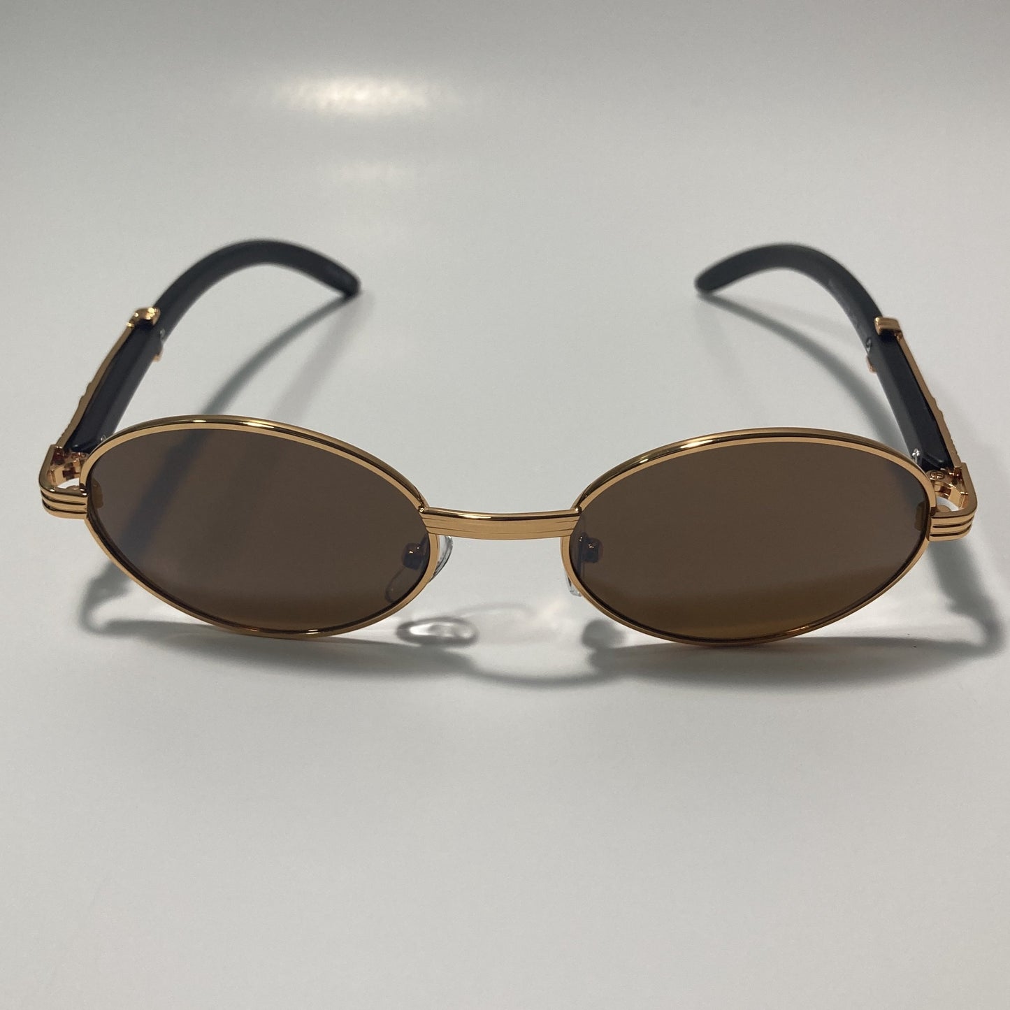 mens and womens brown and gold round sunglasses